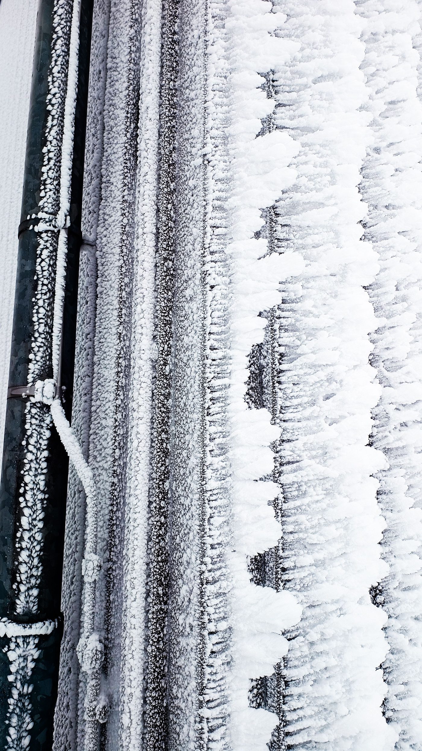 Pipes covered in thick frost and ice